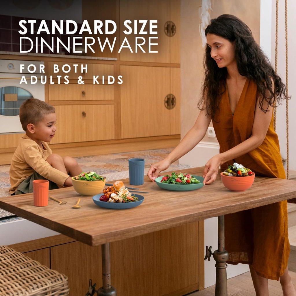 Young child independently using wheat straw plate and utensils during mealtime